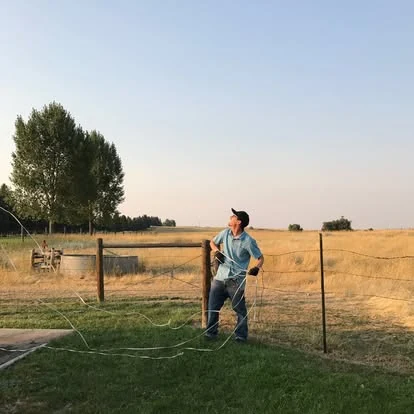Worker doing field work on a rural property