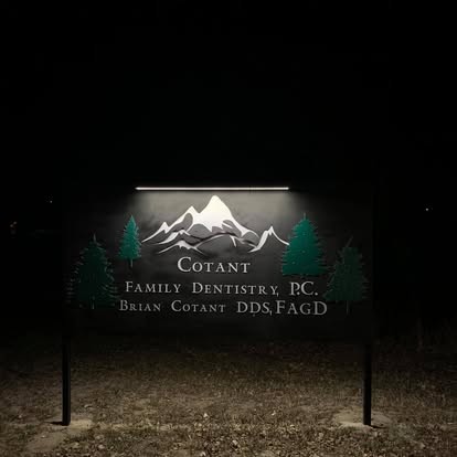 Illuminated business sign at night