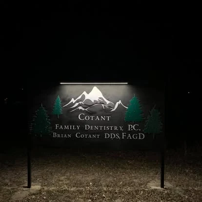 Illuminated business sign at night